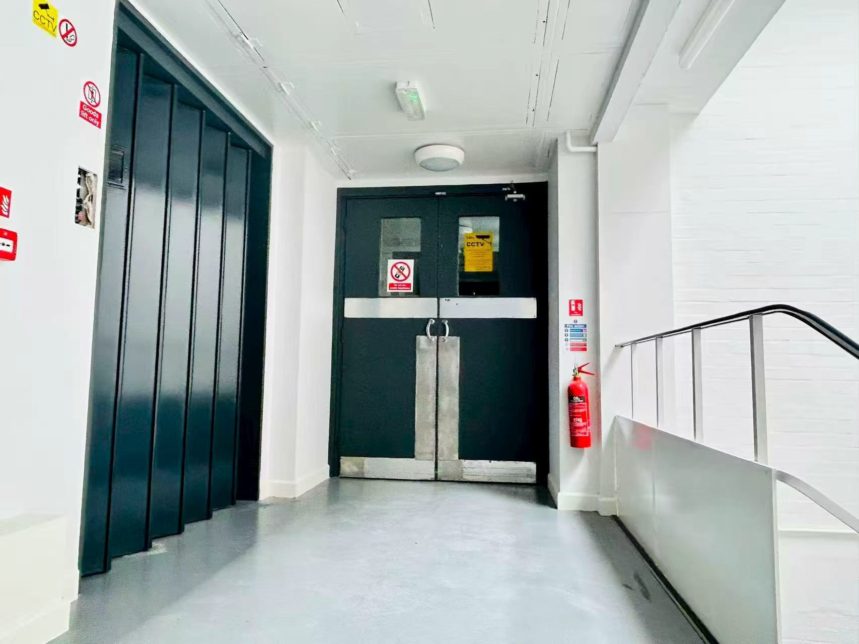 Goods lift and fire doors on the FrontX warehouse floor